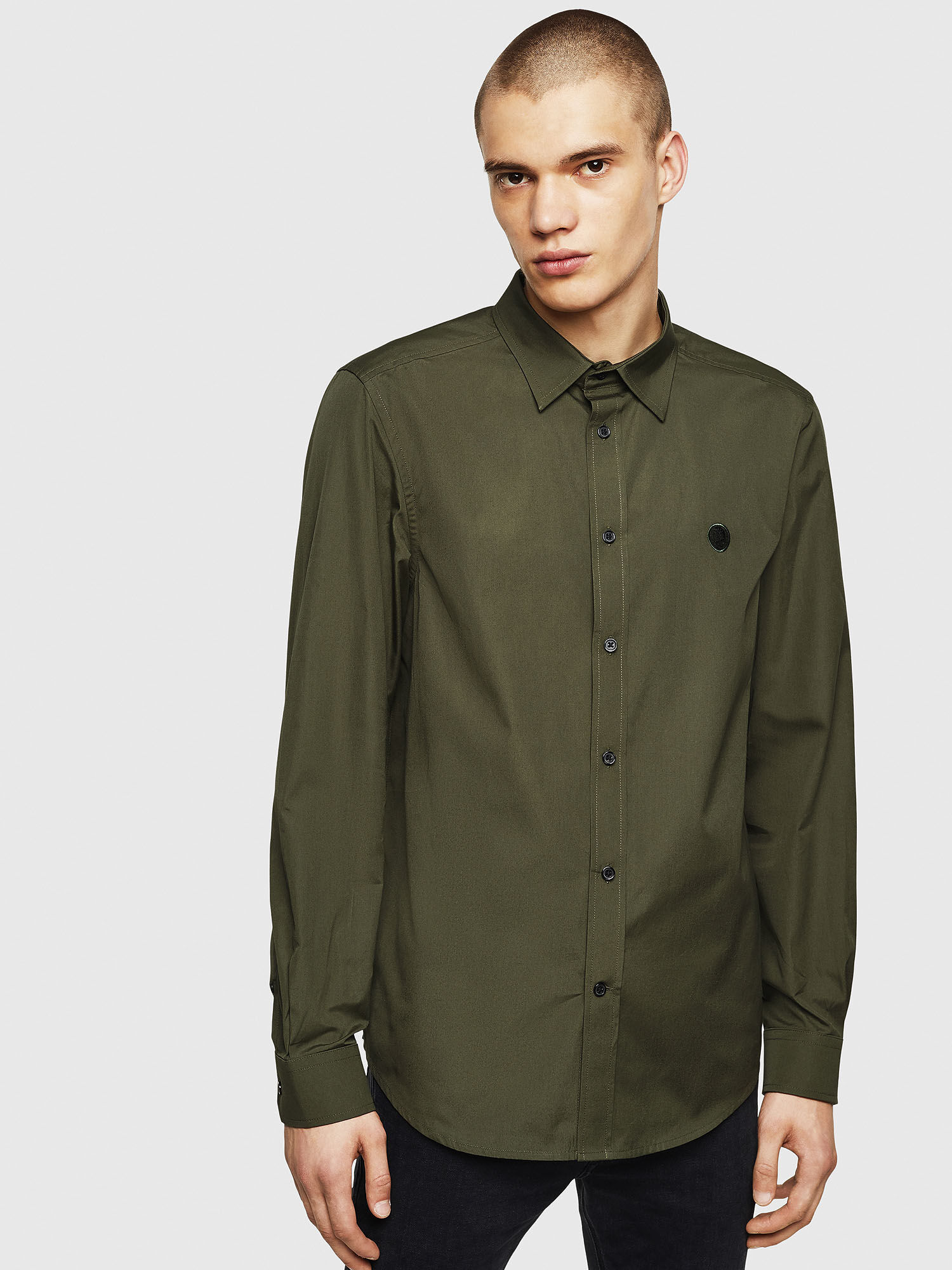 dark green shirt grey pants