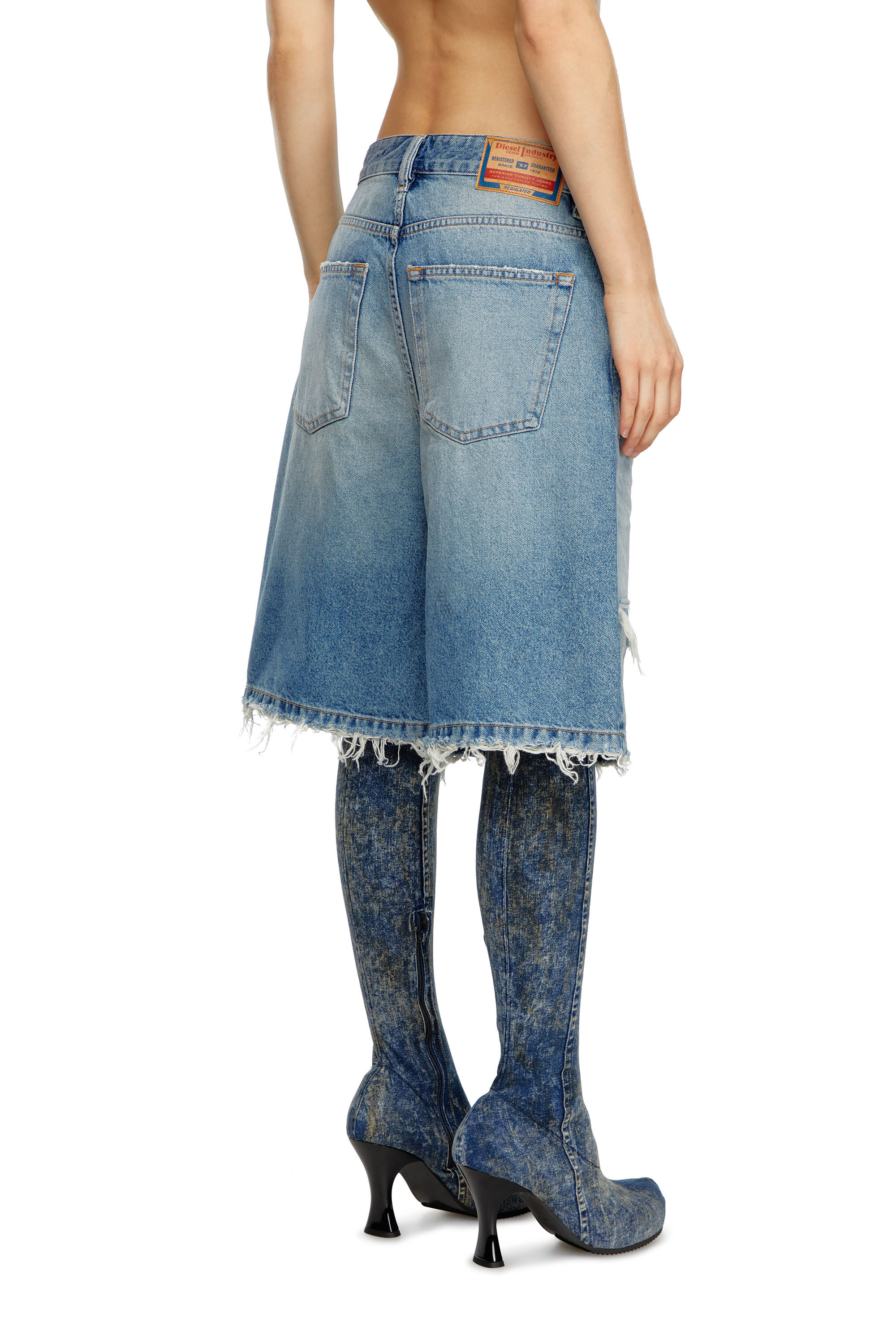 Women's Shorts in ripped and repaired denim | Blue | Diesel