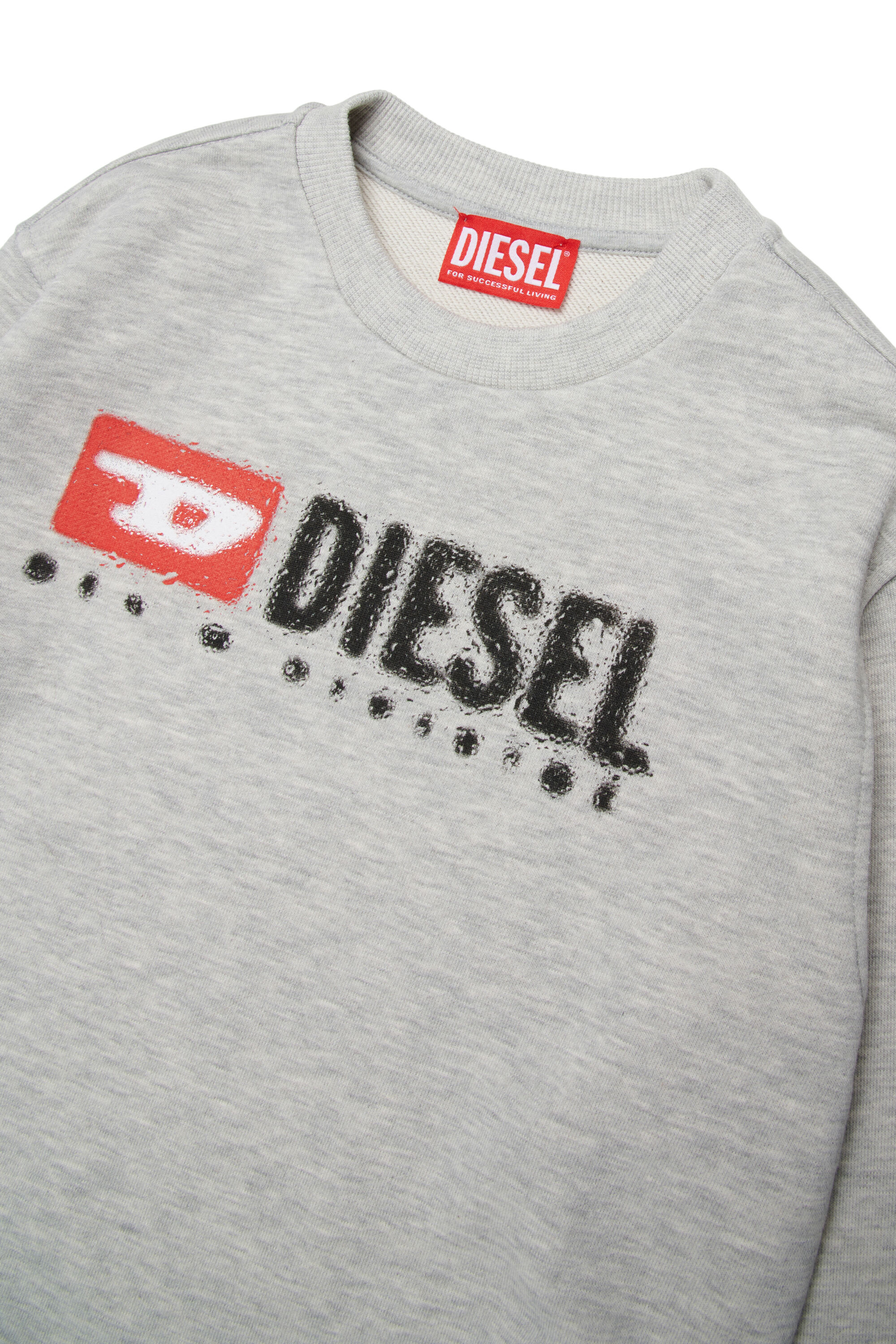 DIESEL メタルロゴ ワンピース S SDROPS OVER
